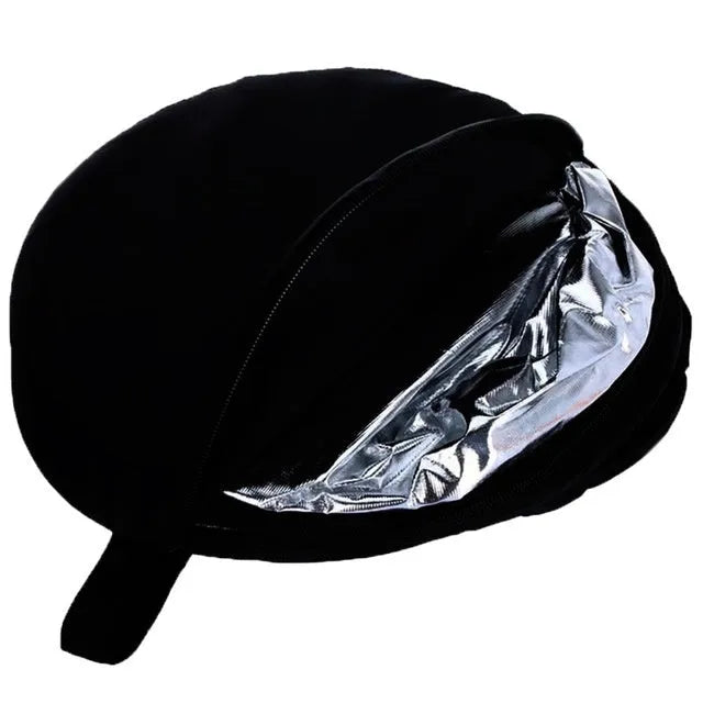 Collapsed 5-in-1 photography light reflector with gold, silver, white, black, translucent surfaces next to its carrying bag.