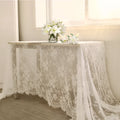 White embroidered lace tablecloth made from nylon yarn, 150x300cm, laid flat on a table with decorative pattern visible.