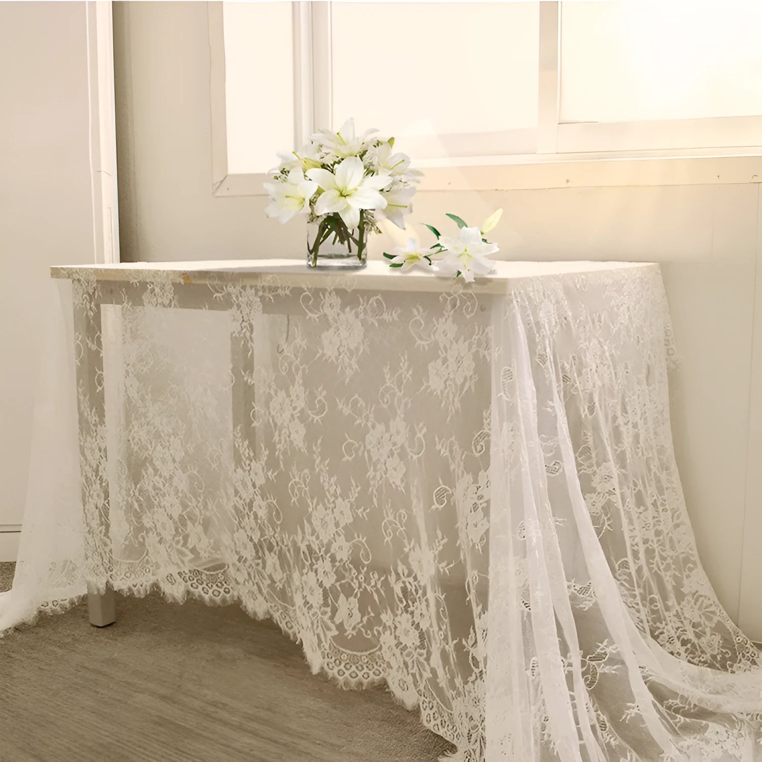 White embroidered lace tablecloth made from nylon yarn, 150x300cm, laid flat on a table with decorative pattern visible.