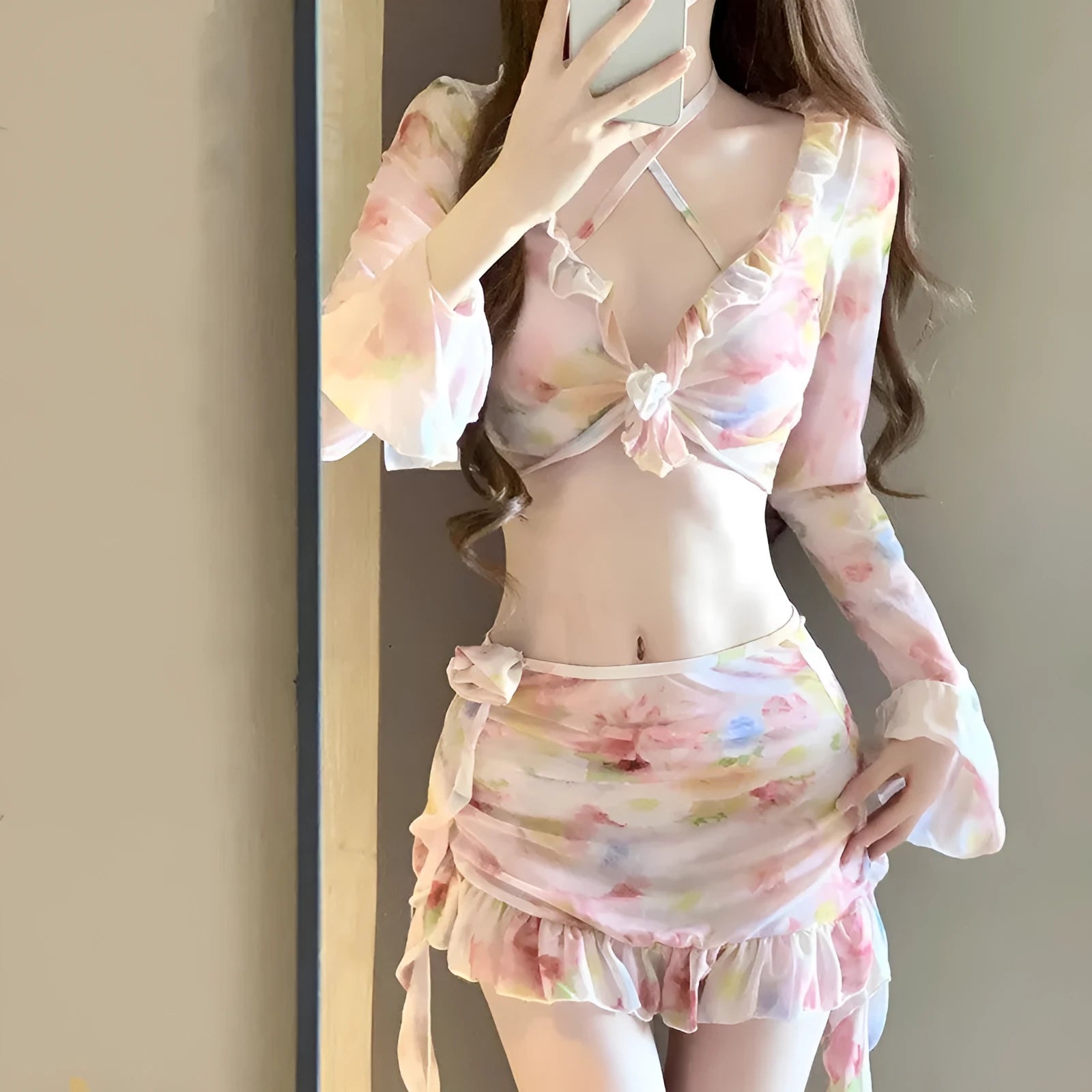 Women's cherry blossom pink floral print bikini swimsuit set on a mannequin.