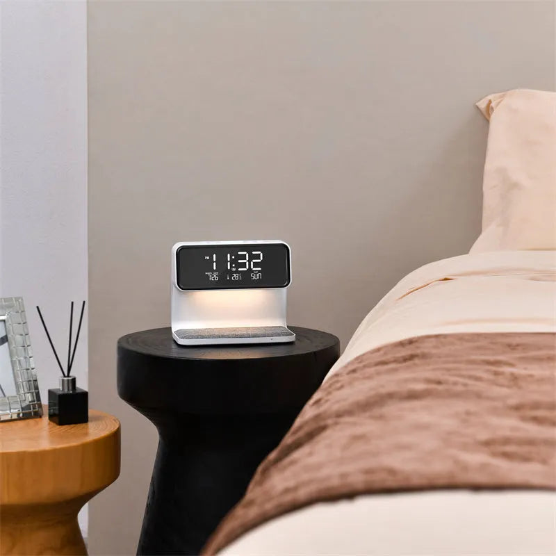 White bedside lamp with integrated wireless charging pad and LCD alarm clock display