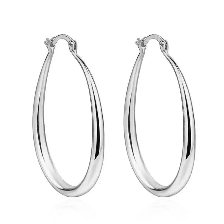 Geometric oval metal earrings for women with electroplated finish and alloy inlaid gems in gold and silver