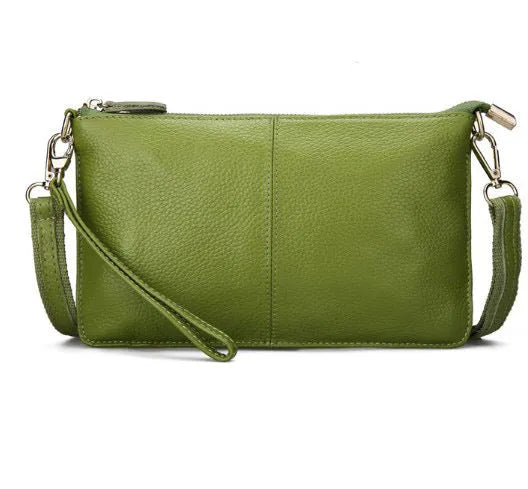 A cowhide lady slant bag in a chosen colour, showing hand and shoulder straps, with dimensions of 24 cm by 14 cm.