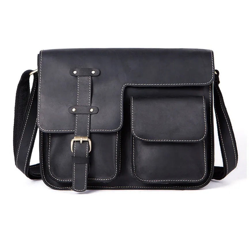 Brown full-grain leather vintage messenger bag with brass hardware, shown with strap adjusted