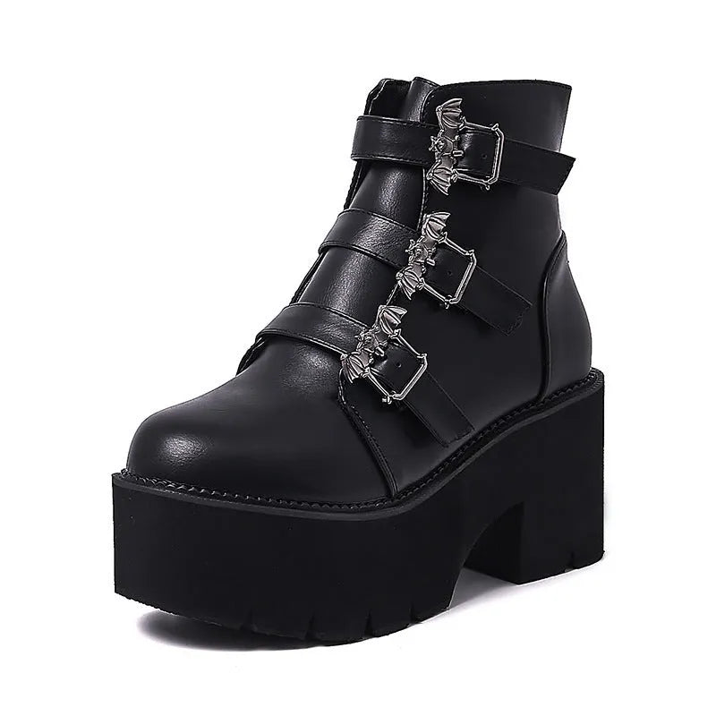 Black women's punk platform ankle boots with bat buckle and side zip.