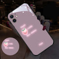 White luminous iPhone case with painted daisies and voice-activated colour-changing LED lights on a smartphone.