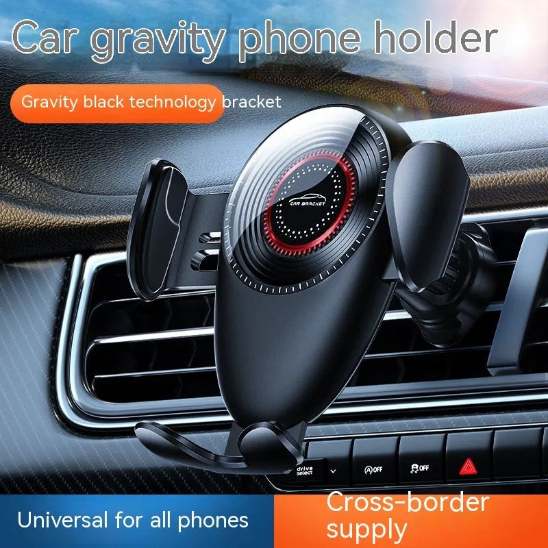 Black car air vent phone bracket with adjustable clamp arms mounted on vehicle ventilation system
