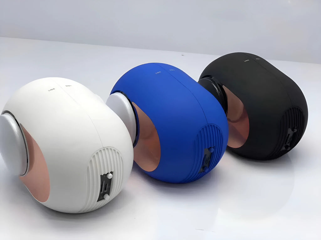 Small golden egg-shaped portable Bluetooth speaker in black, white, or blue colour.