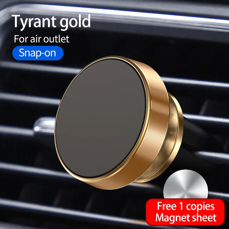 Black magnetic car phone holder mounted on a car dashboard, holding a smartphone