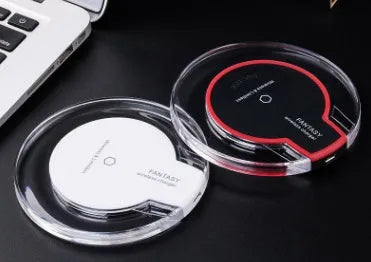 Black wireless charging pad compatible with Samsung Galaxy and iPhone smartphones