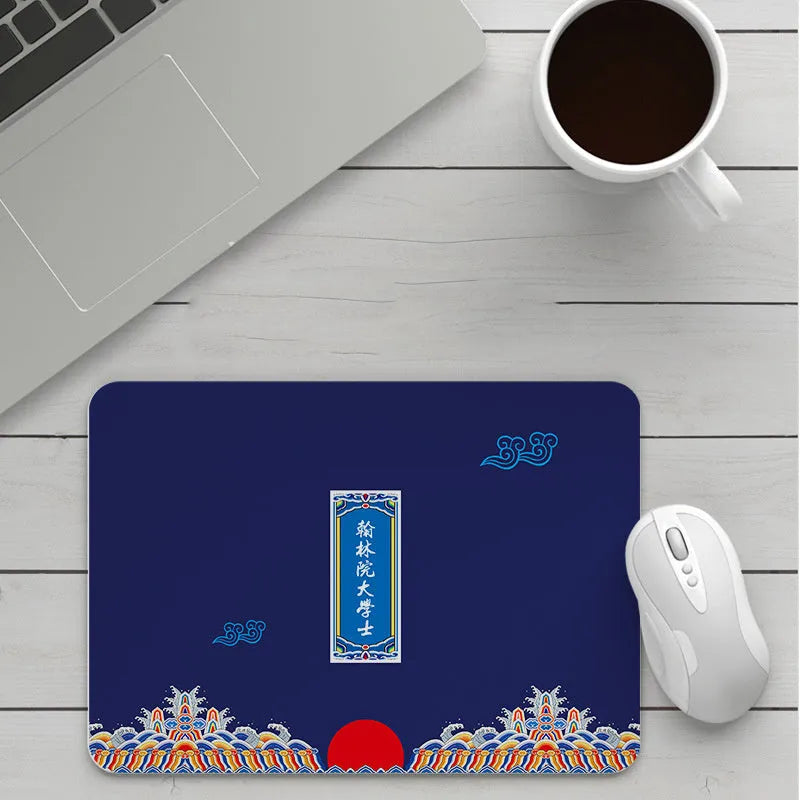 Thick custom cartoon mouse pad with colourful design on a desk, showing black seam edge