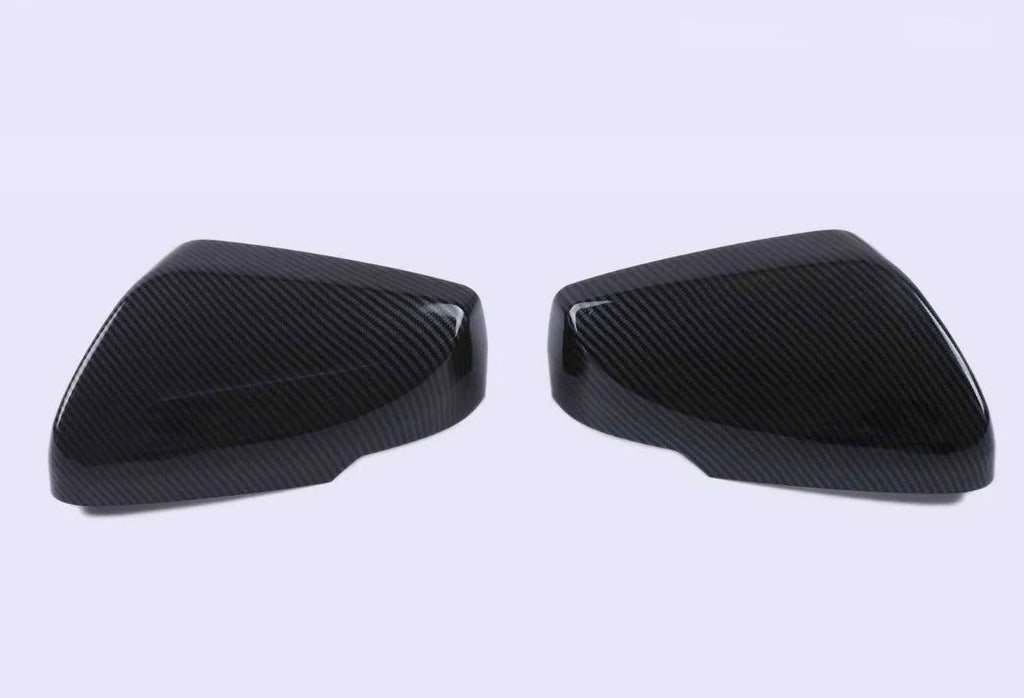 Pair of ABS rearview mirror covers for Cadillac CT5 CT6 in carbon fibre, silver, and rain frame styles.