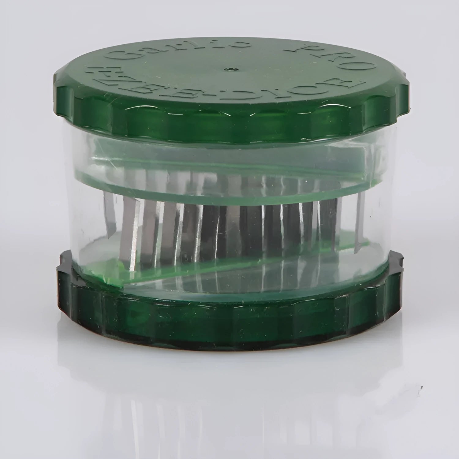Green transparent garlic peeler kitchen gadget showing 8.5cm dimensions