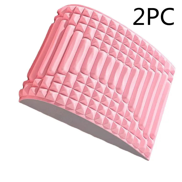Blue back stretcher pillow for lumbar and neck support on a grey background.