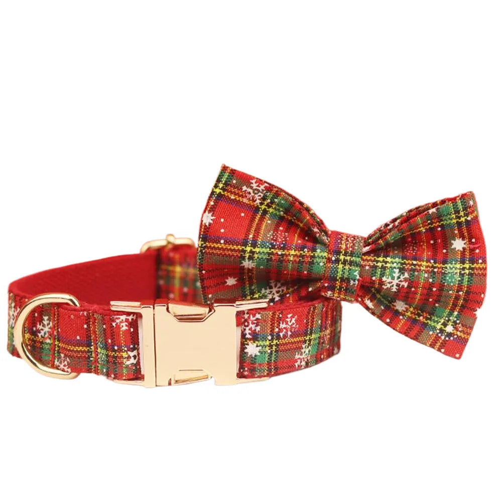 Four-piece Christmas pet accessory set with red snowflake collar, plaid leash, festive vest, and bow tie
