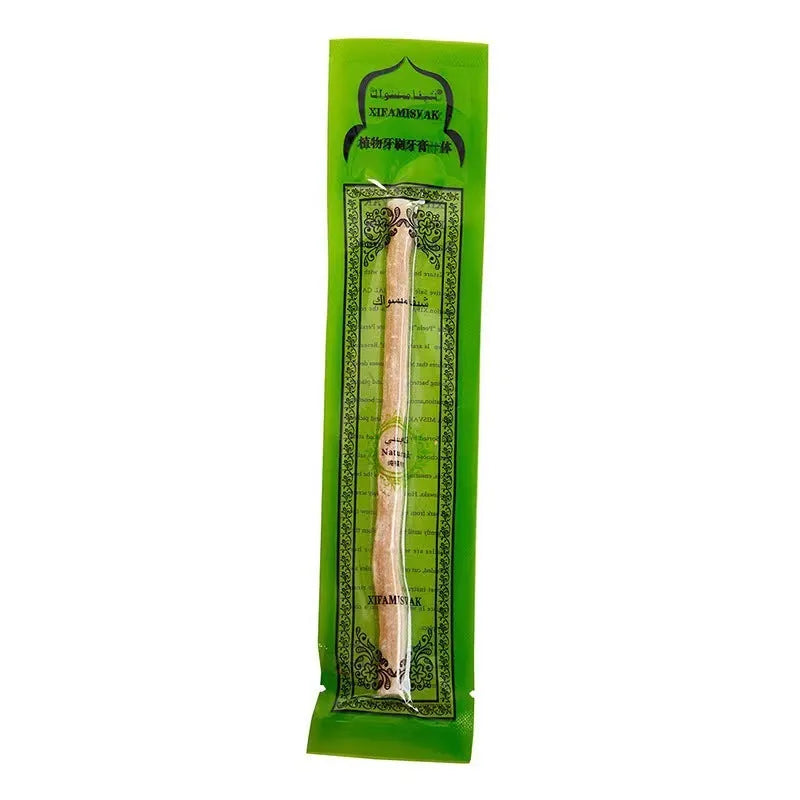 Wooden teeth cleaning stick on bathroom counter for adult oral hygiene