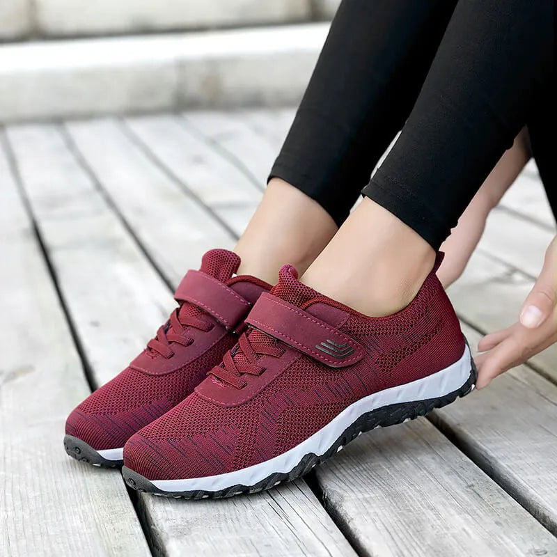 Women's low-top casual shoes with Velcro strap, wedge heel, and breathable mesh upper in a grey purple colour.