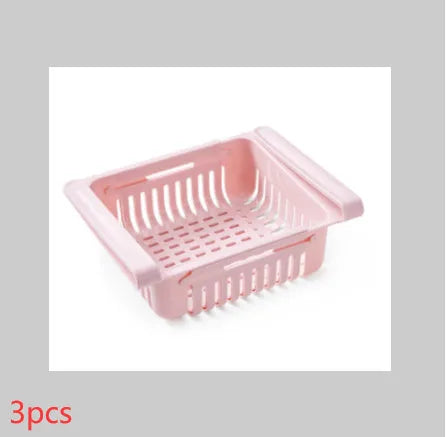 Blue telescopic plastic storage basket for refrigerator organisation with fruits and vegetables inside.