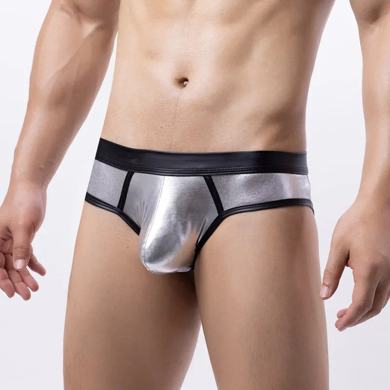 Men's gold low waist polyester bikini swim briefs on a white background.