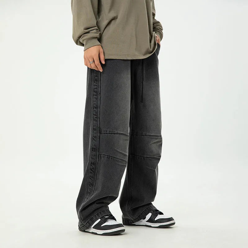 Men's pleated Japanese drawstring trousers in black, loose fit, mid-rise waist, cotton blend fabric, front view