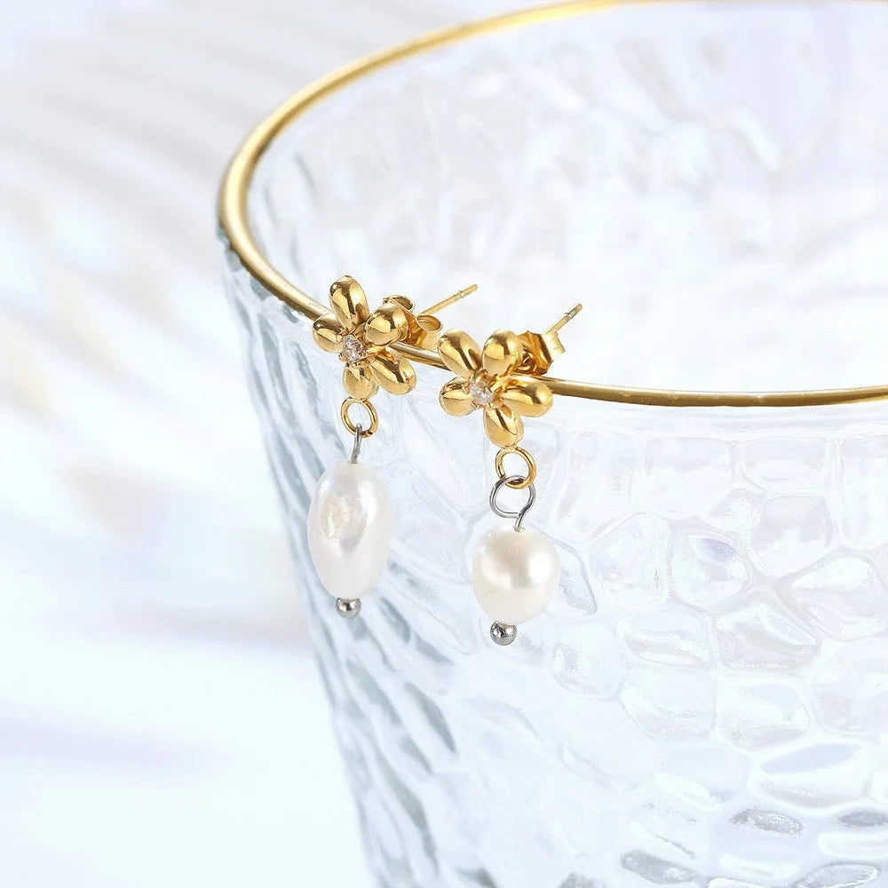 Women's C-shaped titanium steel earrings with pearl inlay flower design in gold