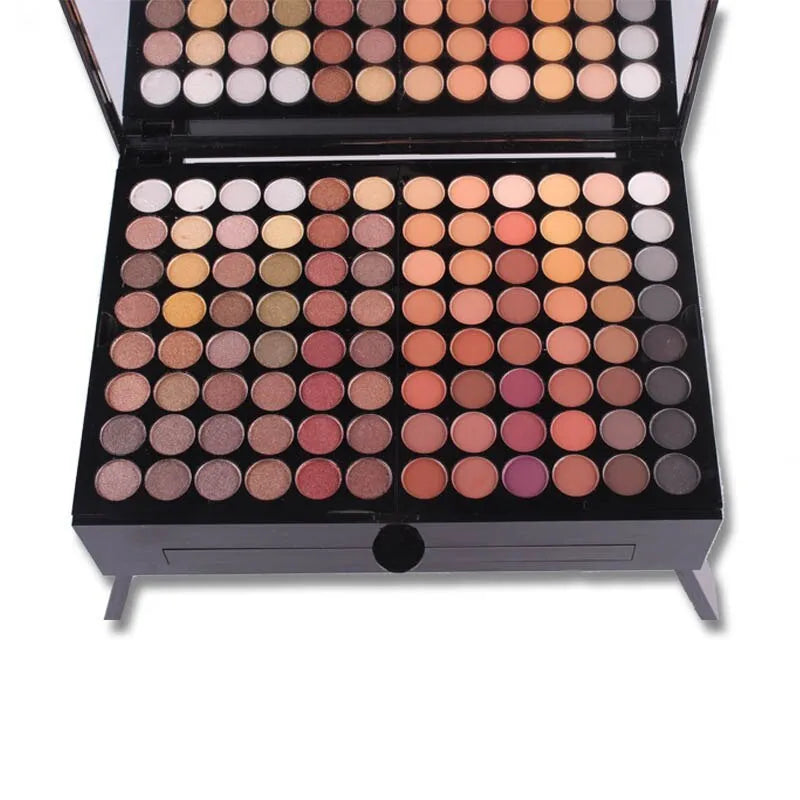 Piano keyboard-shaped makeup palette open to show 180 eyeshadows, blushers, and contour powders.