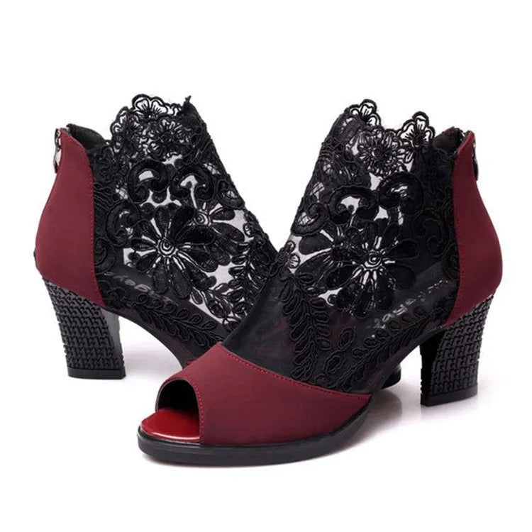 Black lace women's gladiator sandals with a square high heel and peep toe.