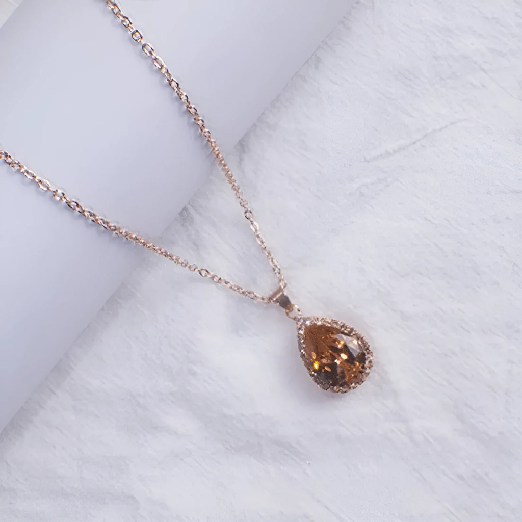 Women's rose gold geometric drop necklace with rhinestone inlay in pink colour