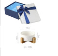 Square kraft paper box with lid in green, size 21.5cm, on a white background