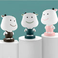 Cartoon animal table lamp in bear, cattle, rabbit or tiger designs with LED light and plastic shade