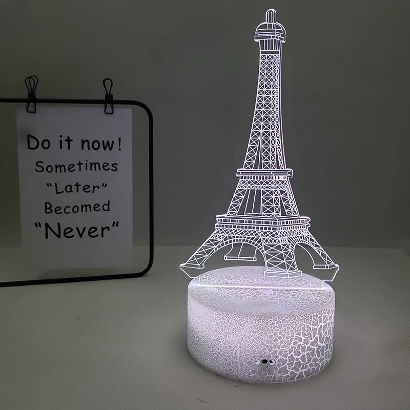 Eiffel Tower shaped 3D acrylic table lamp displaying seven colours, with touch controls and remote.