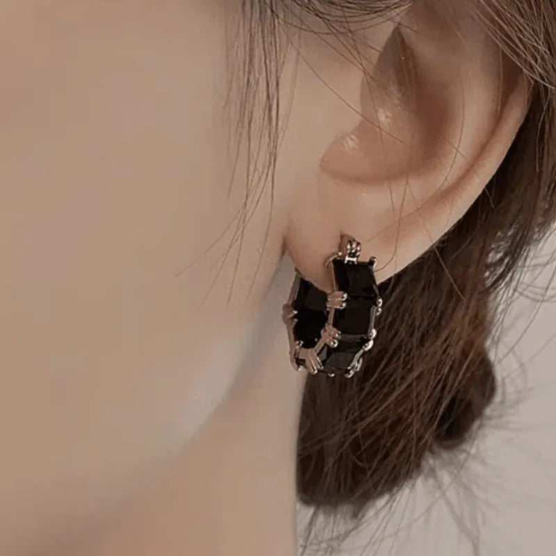 Geometric U-shaped women's earrings with zircon stones and gold plating