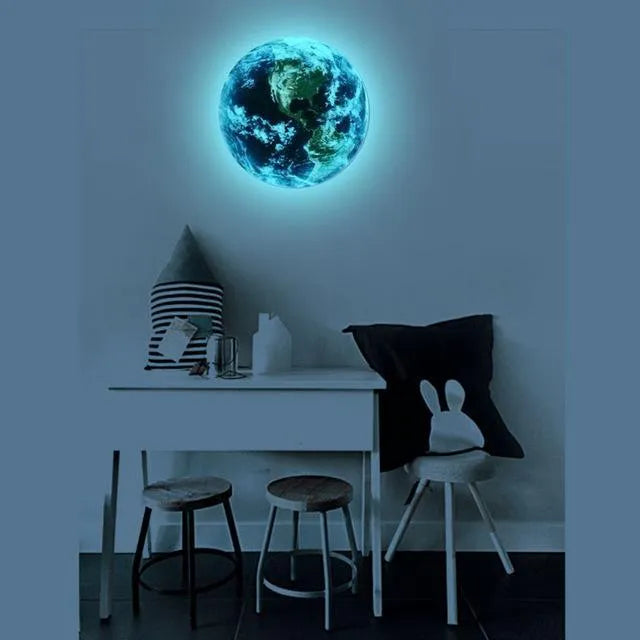 Glow in the dark 3D planet Earth wall sticker in various sizes on a blue wall