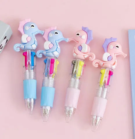 Cartoon Cute Object four-colour press ballpoint pen with random design showing 0.7mm tip.