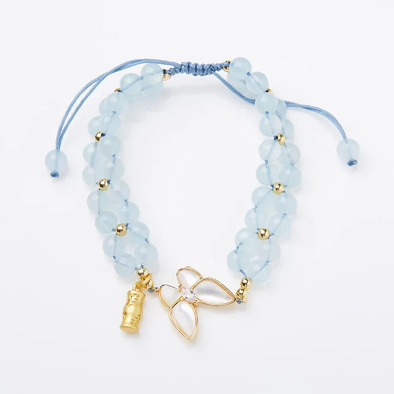 Handmade women's woven bracelet with butterfly design in aquamarine, amethyst or moonstone gemstones