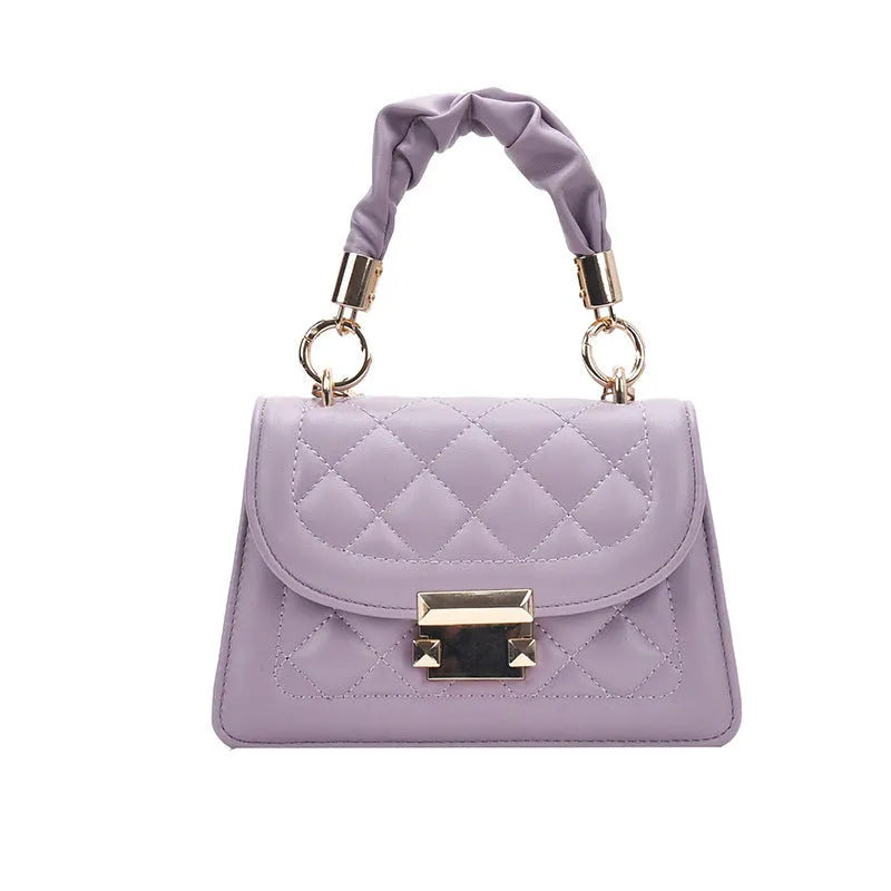 Purple Korean-style ladies square crossbody bag with soft PU texture on a table.