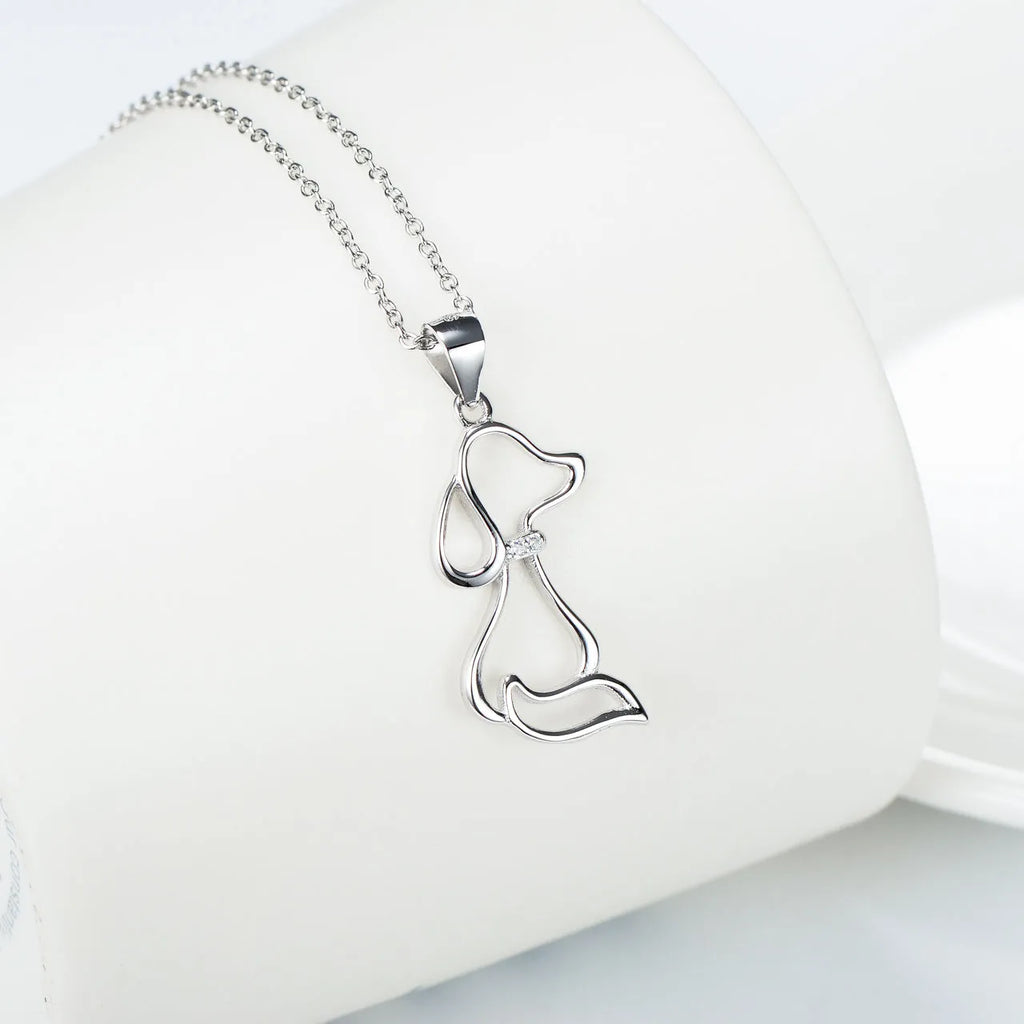 Ladies 925 sterling silver dog pendant necklace with adjustable round bead chain on neutral background