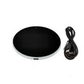 Black USB-powered beverage heating coaster with touch control and coloured LED lights on a wooden desk.