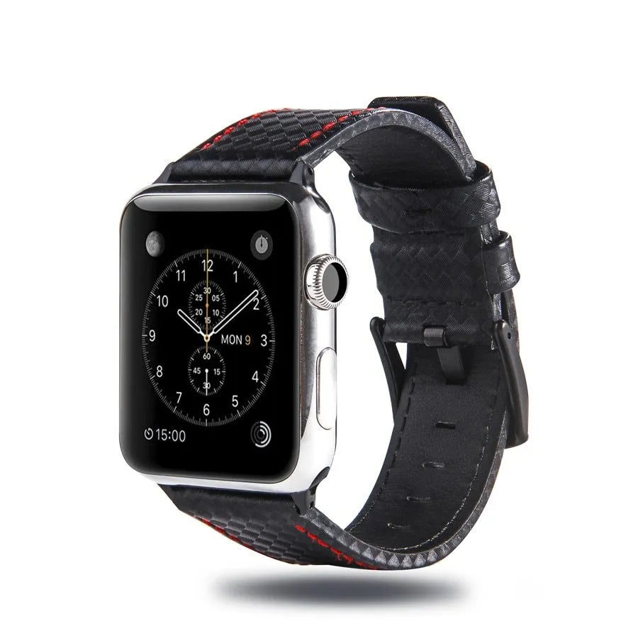 Leather and carbon fibre Apple Watch strap with red stitching next to a black PC case with carbon fibre pattern.