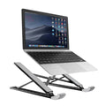 Folding aluminium laptop stand in silver, open and holding a laptop, with non-slip silicone pads visible