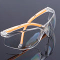 Transparent yellow-tinted labour protection safety goggles for workplace use