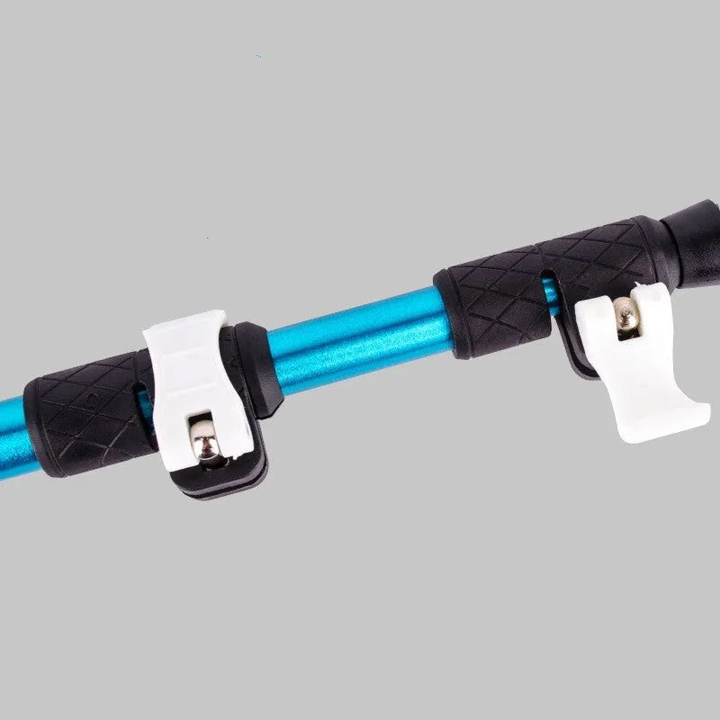 Blue aluminium alloy trekking pole with straight handle extended to full length against a natural outdoor background