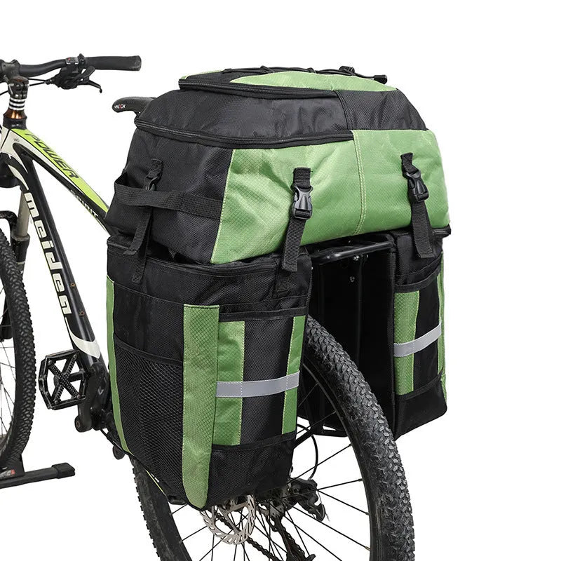 Rhinoceros large green bicycle rear pannier bag mounted on a bike rack for touring.