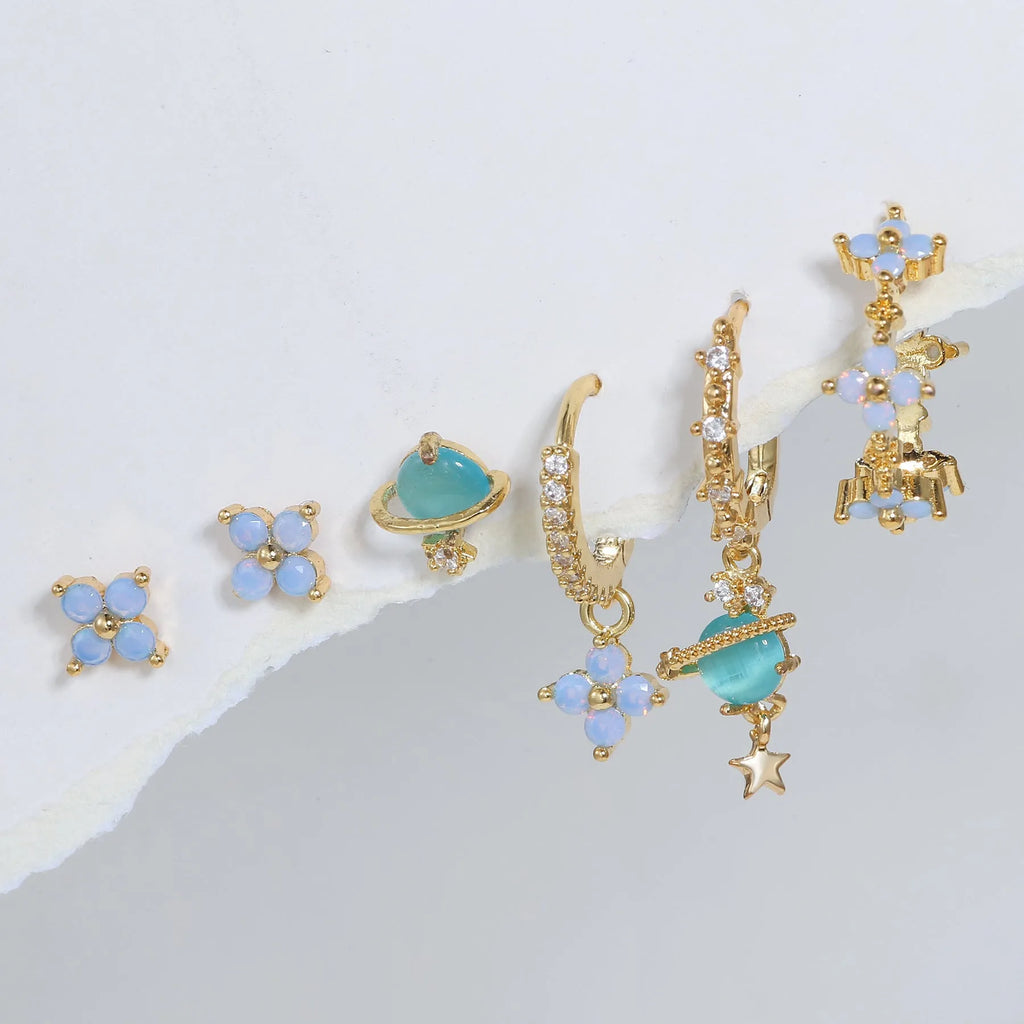 Gold and silver floral ear studs with zircon mosaic details in Japanese Korean style.