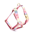 Pink dog harness with gold buckle and colourful heart-shaped stone decoration in four adjustable sizes