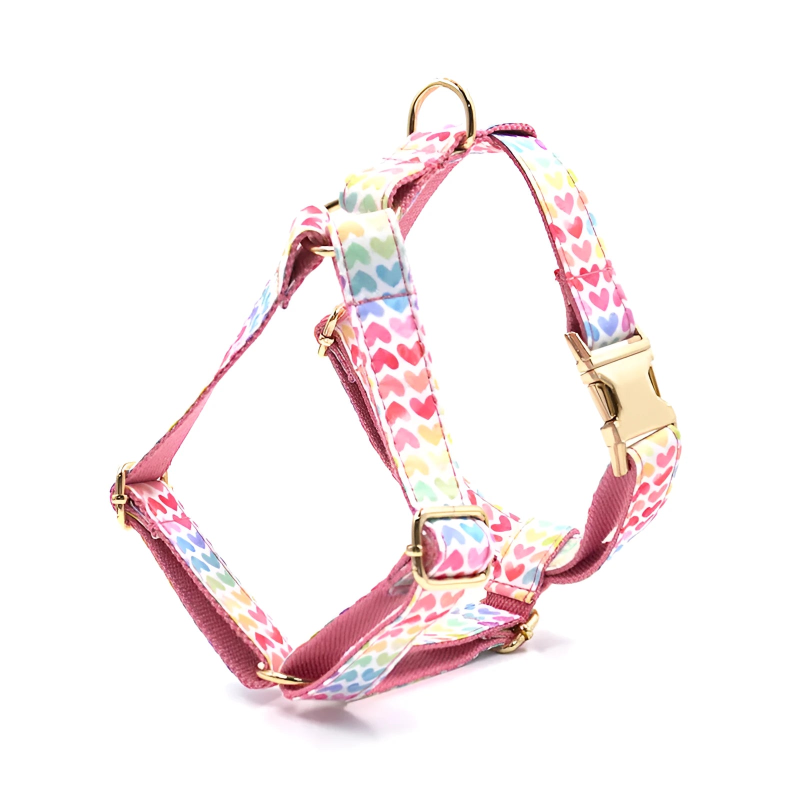 Pink dog harness with gold buckle and colourful heart-shaped stone decoration in four adjustable sizes