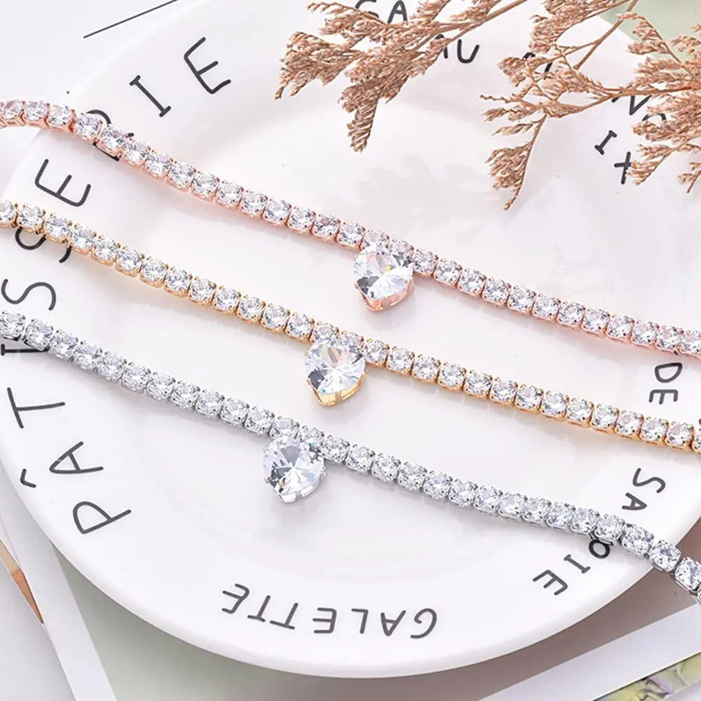 Gold heart-shaped rhinestone collar for dogs and cats on a white background.