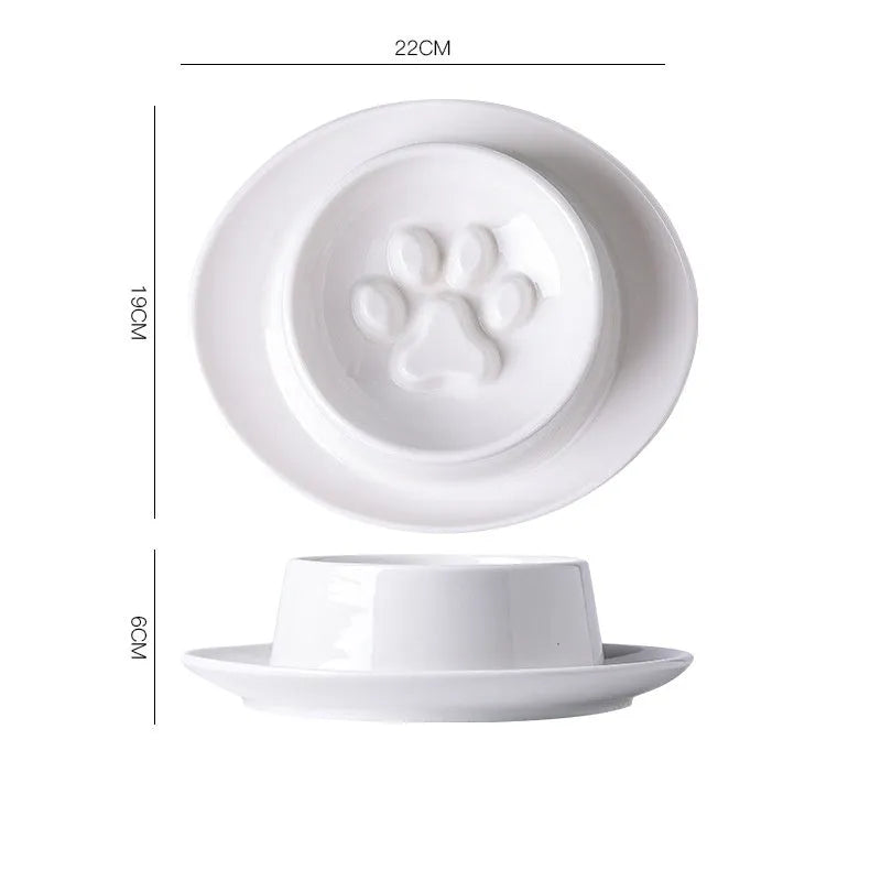 Green ceramic anti-choking slow food bowl for cats and dogs on a flat surface.