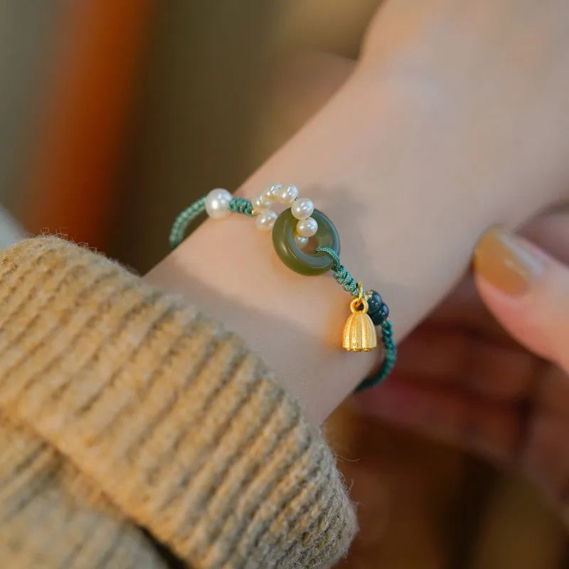 Hand-woven flexible wire watch bracelet with a pearl peace buckle in retro style for women.