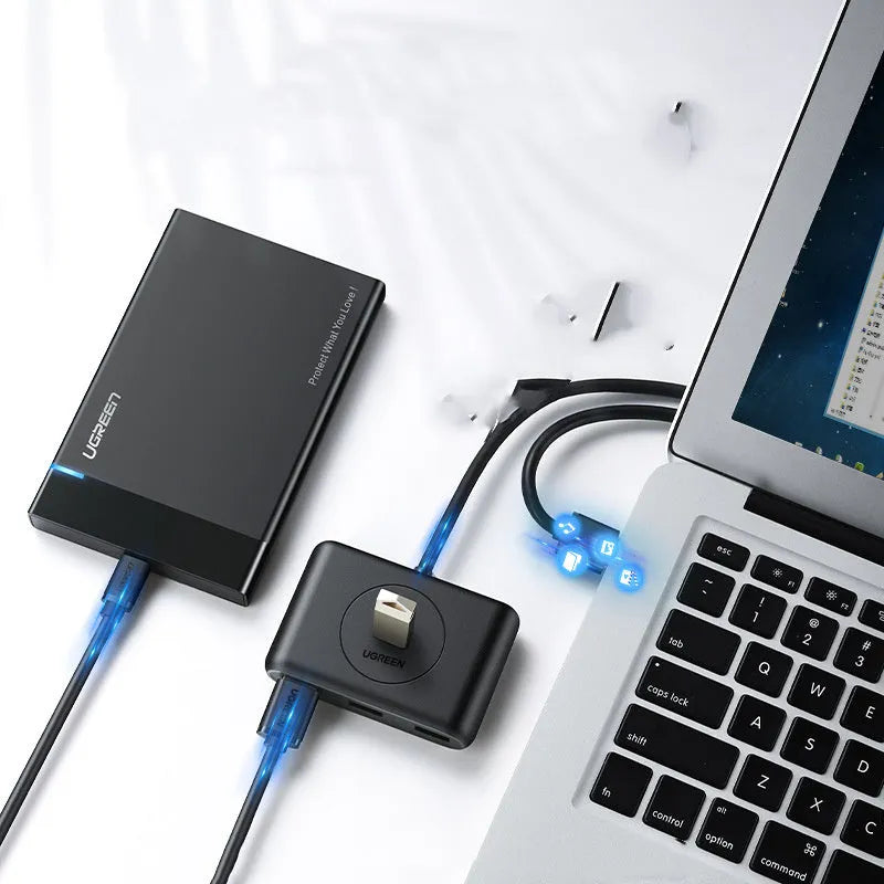 Black USB 3.0 extender adapter set with a multi-port hub and a choice of cable lengths on a desk.